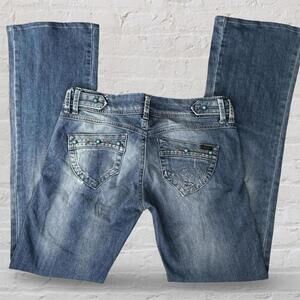 y2k low rise flare jeans with contrast stitching and turquoise stone details